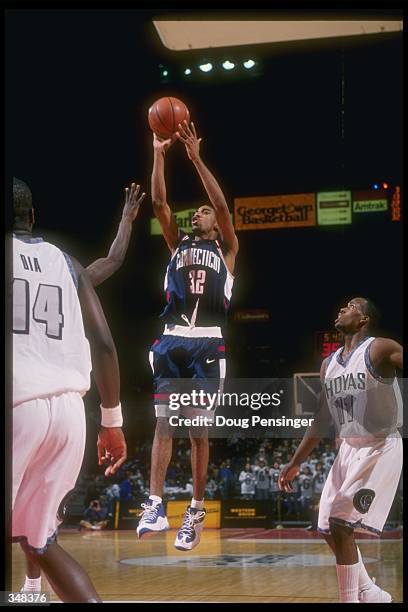 Guard Richard Hamilton of the Connecticut Huskies shoots the ball during a game against the Georgetown Hoyas at the USAir Arena in Landover,...