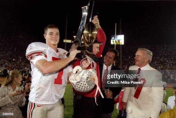 Ohio State Buckeyes head coach John Cooper and Joe Germaine celebrate after the Rose Bowl against the Arizona State Sun Devils at the Rose Bowl in...