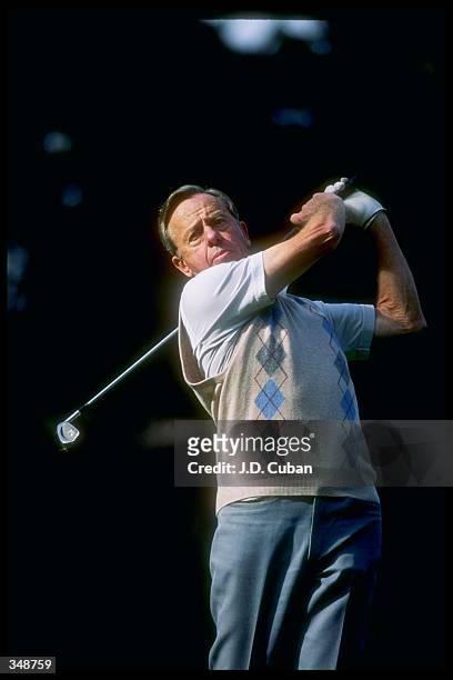 Former NASA astronaut Alan Shephard watches the ball fly during a golfing event. Mandatory Credit: J. D. Cuban /Allsport