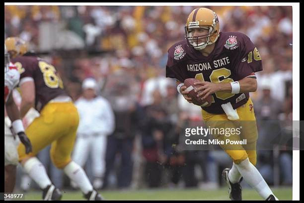 Quarterback Jake Plummer of the Arizona State Sun Devils moves the ball during the Rose Bowl against the Ohio State Buckeyes at the Rose Bowl in...