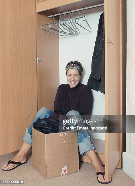 woman with cardboard box - shoes box stock-fotos und bilder