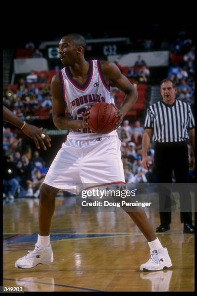 Kobe Bryant looks to pass the ball during the McDonald''s All-American at the Civic Arena in Pittsburgh, Pennsylvania. Mandatory Credit: Doug...