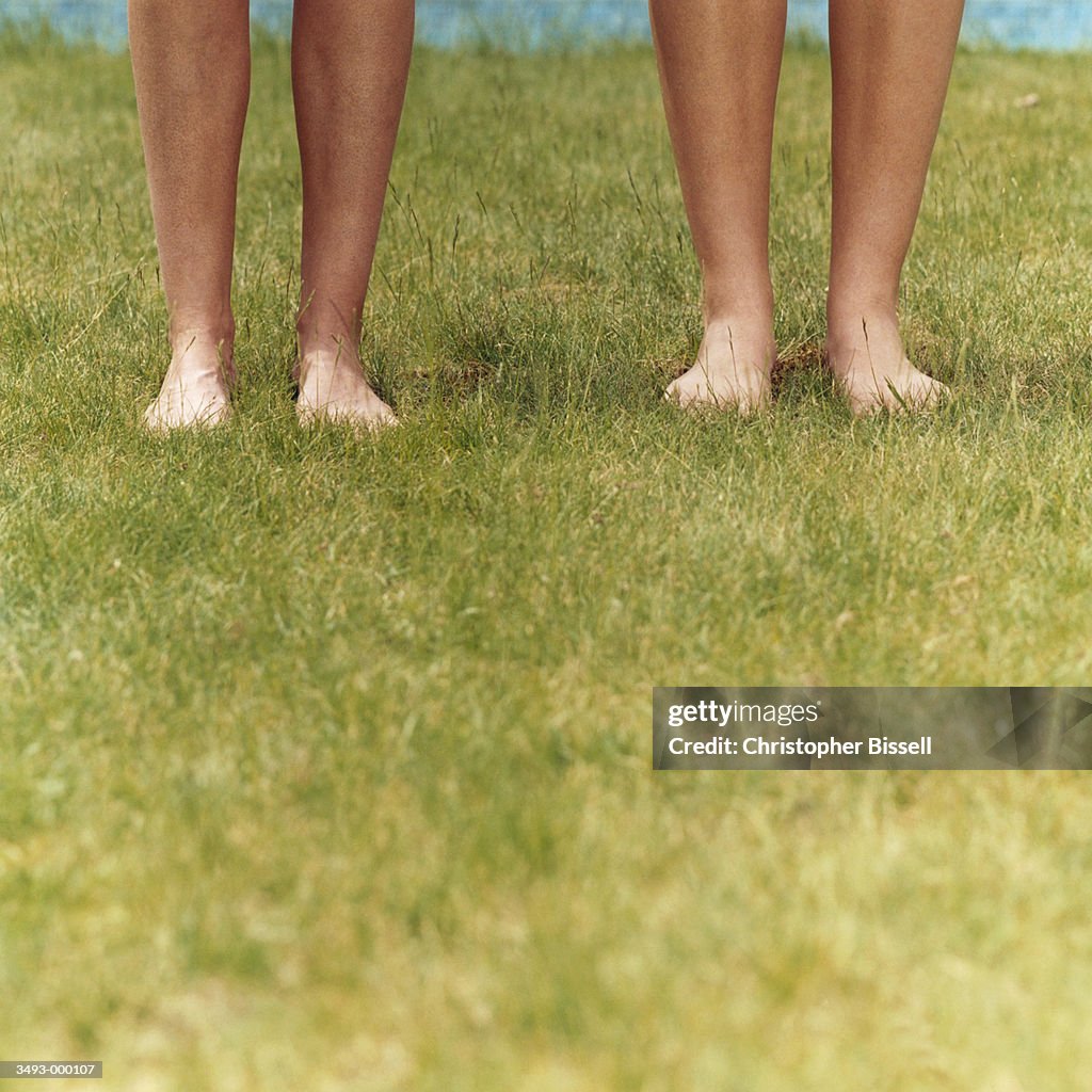 People with Barefeet on Grass