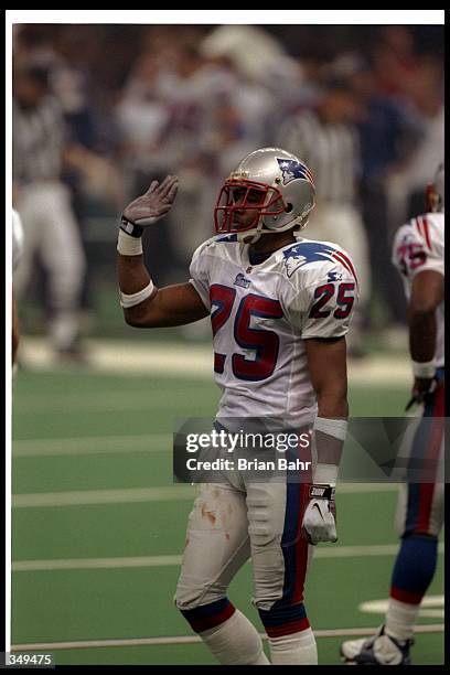 Defensive Back Larry Whigham Of The New England Patriots Looks On defensive-back-larry-whigham-of-the-new-england-patriots-looks-on