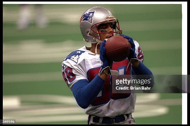 Wide receiver Terry Glenn of the New England Patriots catches the ball during Super Bowl XXXI against the Green Bay Packers at the Superdome in New...