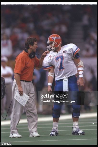 Florida Gators head coach Steve Spurrier confers with quarterback Danny Wuerffel during the Nokia Sugar Bowl against the Florida State Seminoles at...