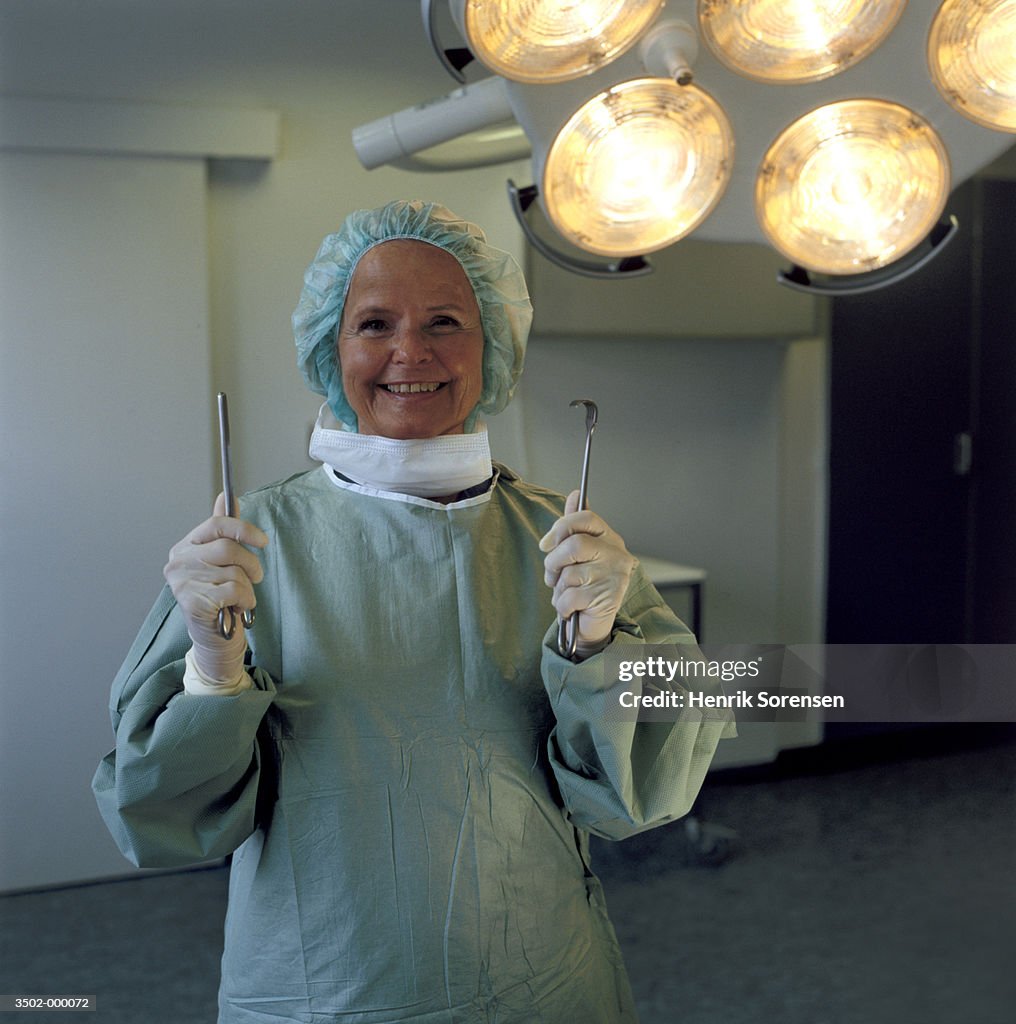 Surgeon Holding Scissors