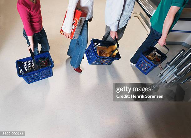 people queuing with baskets - lining up stock-fotos und bilder