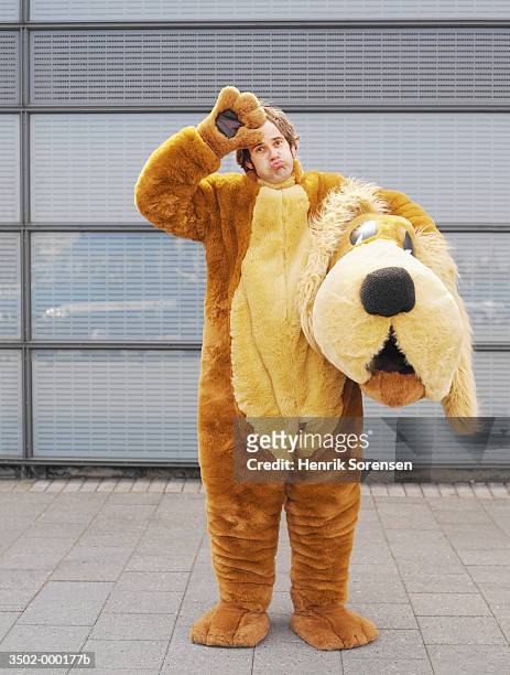 man in dog costume - animal themes stock pictures, royalty-free photos & images
