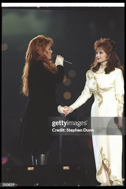 Naomi and Wynonna Judd perform during the half-time show for Super Bowl XXVIII between the Buffalo Bills and the Dallas Cowboys at the Georgia Dome...