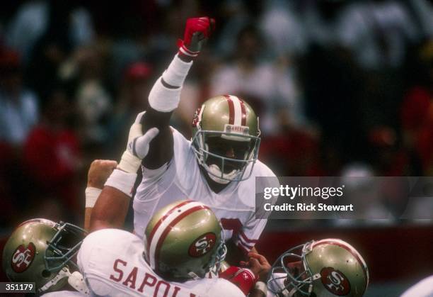 Wide receiver Jerry Rice of the San Francisco 49ers celebrates with his teammates during Super Bowl XXIV against the Denver Broncos at the Superdome...