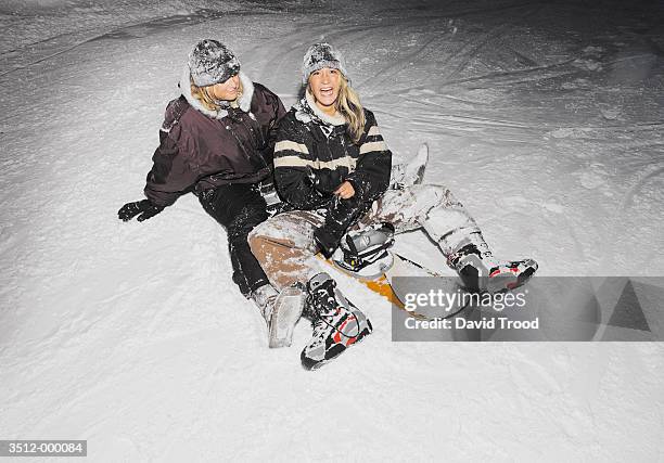 women snowboarding - women winter snow stock-fotos und bilder