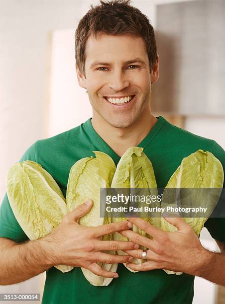 man holding chicory - chicory stock pictures, royalty-free photos & images