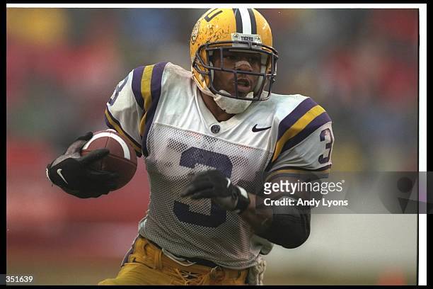 Running back Kevin Faulk of the Louisiana State Tigers moves the ball during a game against the Arkansas Razorbacks at the War Memorial Stadium in...