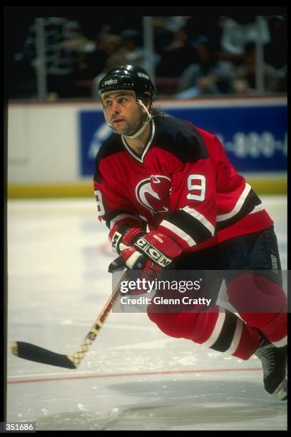 Center Neal Broten of the New Jersey Devils moves down the ice during a game against the Anaheim Mighty Ducks at Arrowhead Pond in Anaheim,...