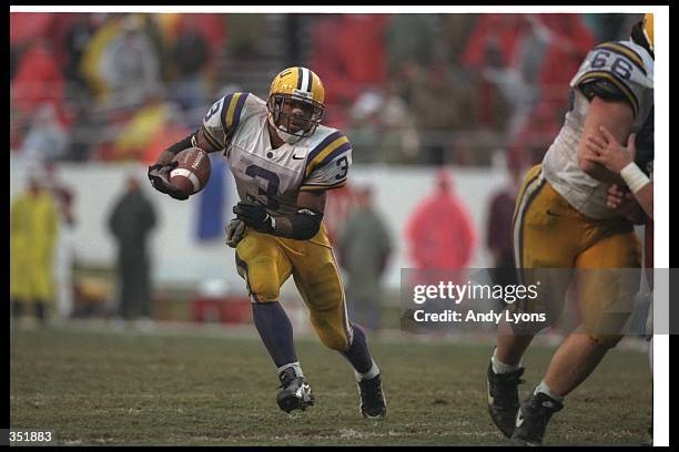 Running back Kevin Faulk of the Louisiana State Tigers moves the ball during a game against the Arkansas Razorbacks at the War Memorial Stadium in...