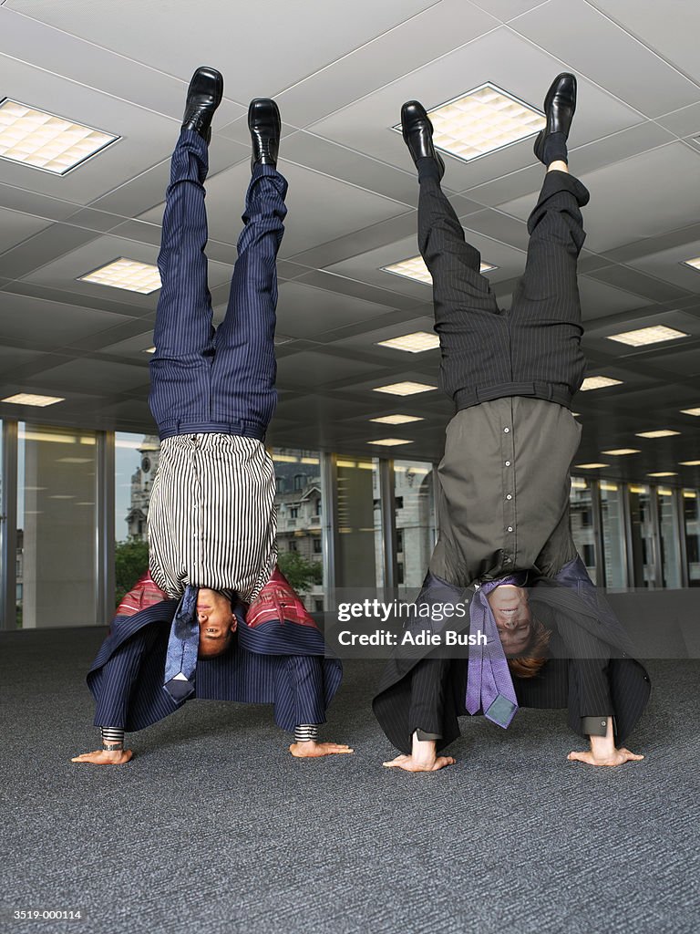 Businessmen Doing Handstands