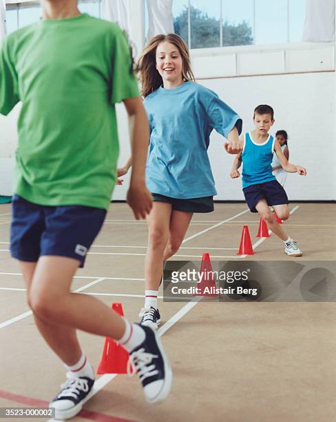 children exercising - sportunterricht stock-fotos und bilder