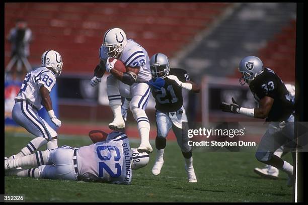 Running back Anthony Johnson of the Indianapolis Colts moves the ball during a game against the Los Angeles Raiders at the RCA Dome in Indianapolis,...