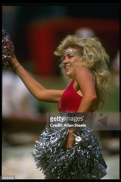 An Atlanta Falcons cheerleader performs during a game against the Los Angeles Rams at the Fulton County Stadium in Atlanta, Georgia. The Rams won the...