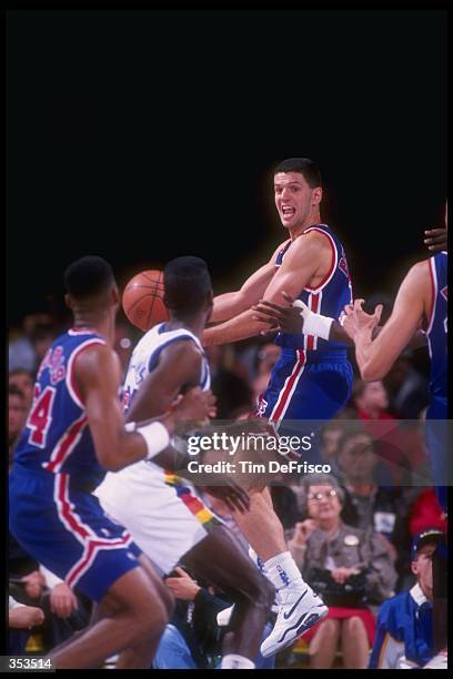 Guard Drazen Petrovic of the New Jersey Nets moves the ball during a game against the Denver Nuggets at the Byrne Meadowlands Arena in East...