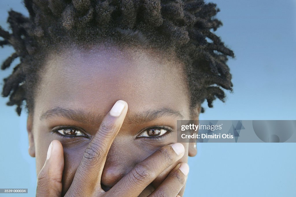 Smiling Woman Covering Face