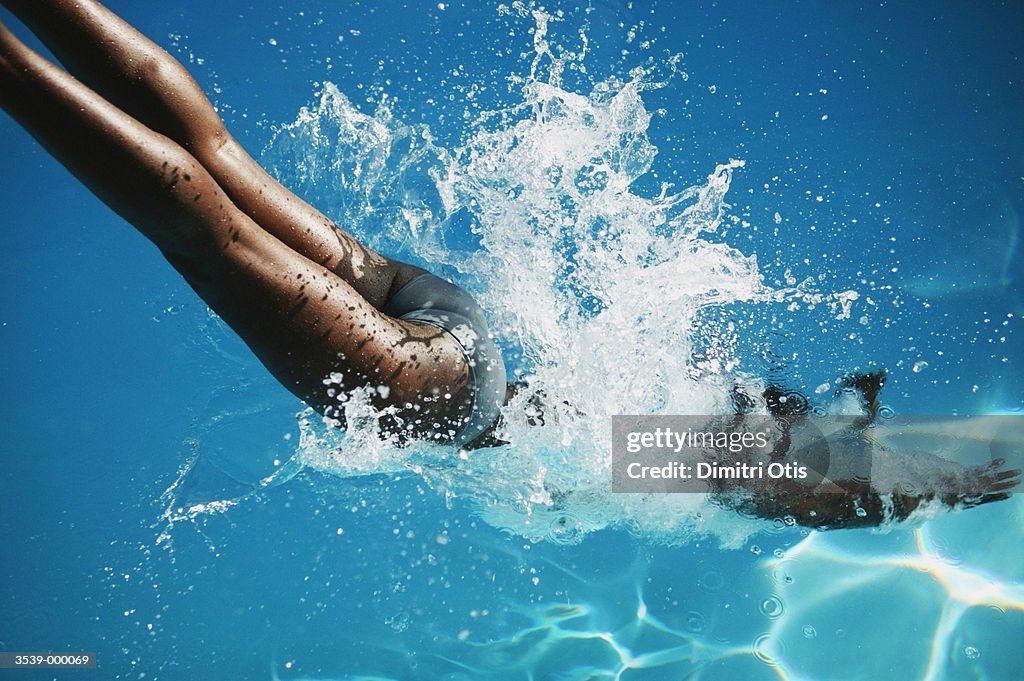 Woman Diving into Water