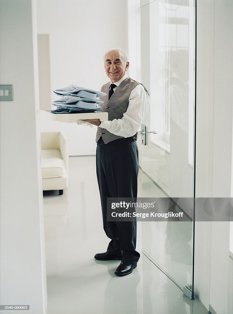 Butler Holding Shirts
