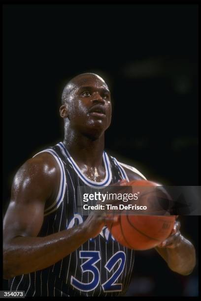 Center Shaquille O''Neal of the Orlando Magic looks to shoot the ball during a game against the Denver Nuggets at McNichols Arena in Denver,...