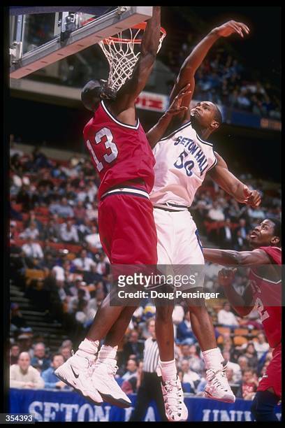 Duane Jordan of Seton Hall tries to block a shot by Donnell Williams of St. Johns during the Pirates 66-62 loss to St. Johns at the Continental...