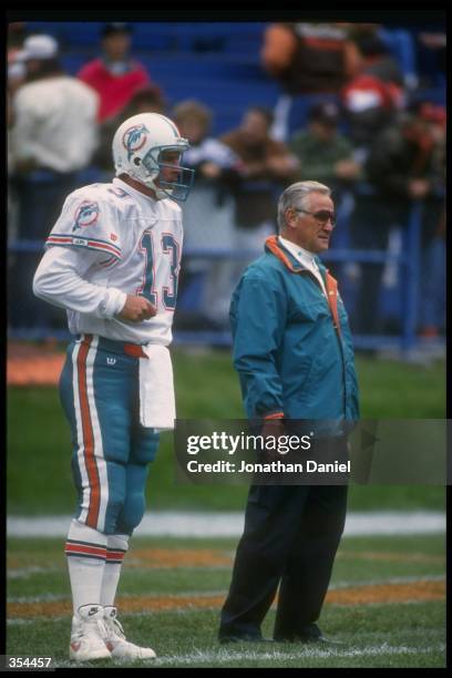 Miami Dolphins quarterback Dan Marino and head coach Don Shula look on during a game against the Cleveland Browns at Cleveland Stadium in Cleveland,...