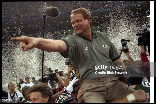 Green Bay Packers head coach Mike Holmgren celebrates after Super Bowl XXXI against the New England Patriots at the Superdome in New Orleans,...