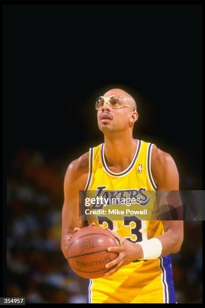 Center Kareem Abdul-Jabbar of the Los Angeles Lakers prepares to shoot the ball during a game against the Dallas Mavericks at Reunion Arena in...