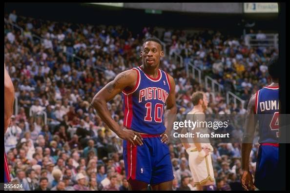 Detroit Rodman Forward Dennis Rodman of the Detroit Pistons looks on during a game ...