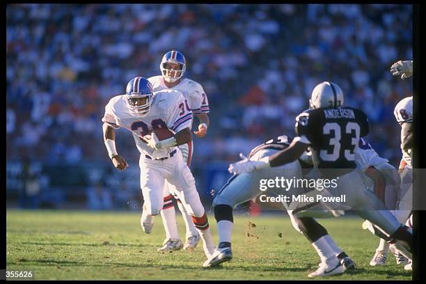 Running back Steve Sewell of the Denver Broncos runs with the ball during a game against the Los Angeles Raiders at the Coliseum in Los Angeles,...