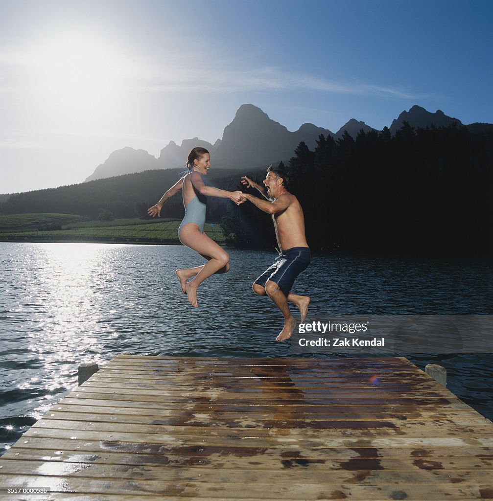 Couple Jumping into Lake