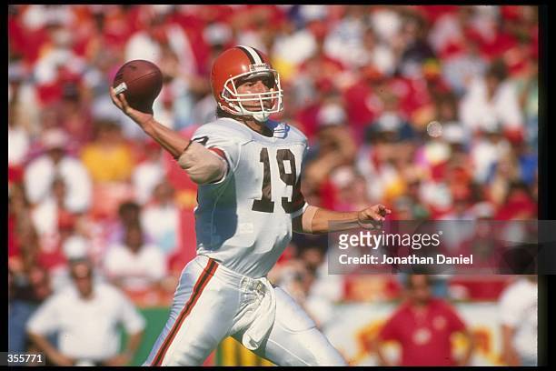 Quarterback Bernie Kosar of the Cleveland Browns passes the ball during a game against the Kansas City Chiefs at Cleveland Stadium in Cleveland,...