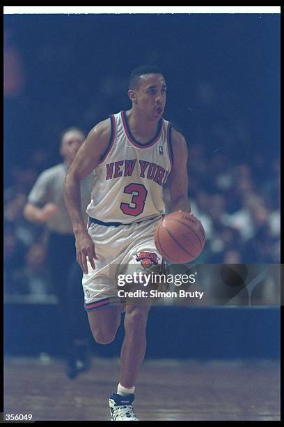 Guard John Starks of the New York Knicks moves the ball during a game at Madison Square Garden in Manhattan, New York. Mandatory Credit: Simon Bruty...