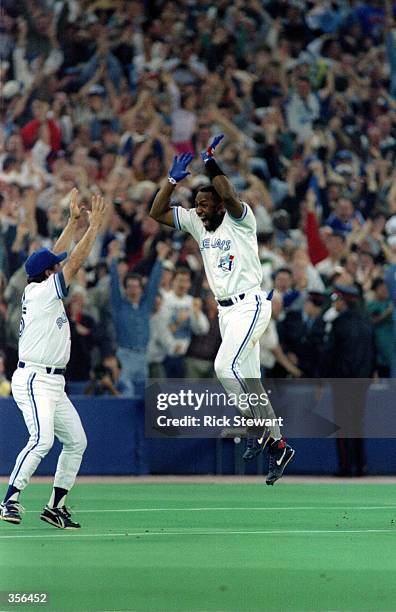 Joe Carter of the Toronto Blue Jays celebrates his 9th inning, 3 run homerun to defeat the Philadelphia Phillies 8-6 to win the 1993 World Series at...