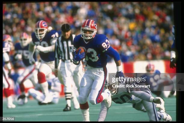 Wide receiver Andre Reed of the Buffalo Bills runs with the ball during a game against the Indianapolis Colts at Rich Stadium in Orchard Park, New...