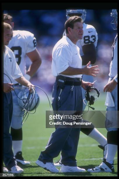 Oakland Raiders assistant coach Joe Bugel looks on during a game against the Baltimore Ravens at Memorial Stadium in Baltimore, Maryland. The Ravens...
