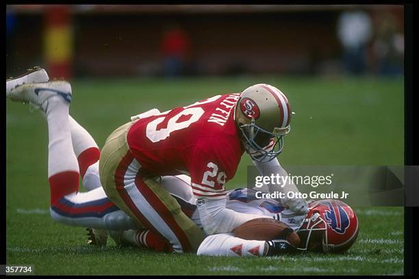 Defensive back Don Griffin of the San Francisco 49ers tackles a Buffalo Bills player during a game at Candlestick Park in San Francisco, California....