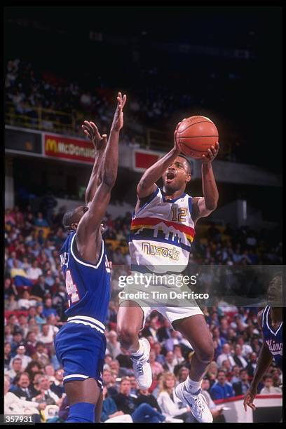 Guard Winston Garland of the Denver Nuggets goes up for two during a game versus the Sacramento Kings at the McNichols Sports Arena in Denver,...