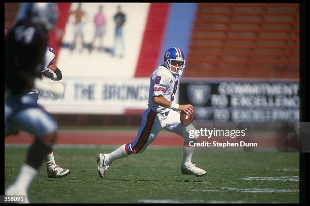 Quarterback Gary Kubiak of the Denver Broncos runs with the ball during a game against the Los Angeles Raiders at the Coliseum in Los Angeles,...