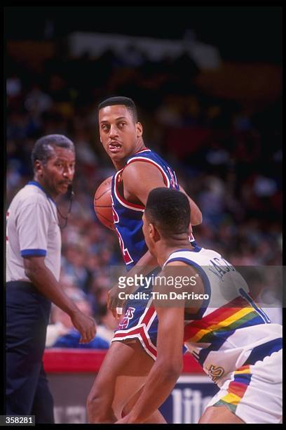 Guard Tate George of the New Jersey Nets looks on during a game against the Denver Nuggets at the McNichols Sports Arena in Denver, Colorado....