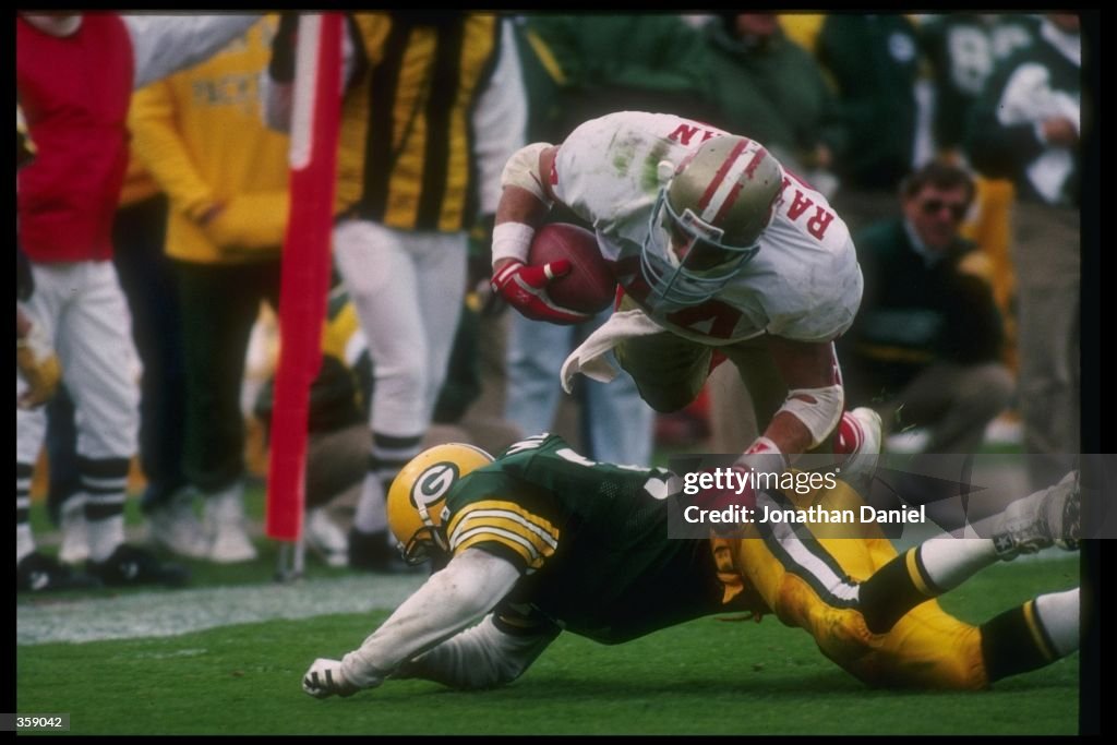 Running back Tom Rathman of the San Francisco 49ers dive for yardage ...