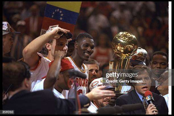 Center Hakeen Olajuwon of the Houston Rockets celebrates after a Finals game against the Orlando Magic at The Summit in Houston, Texas. The Rockets...