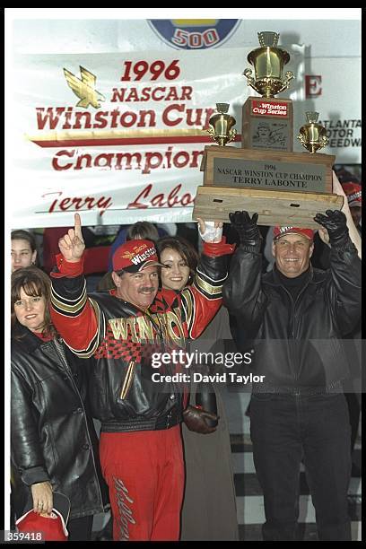 Driver Terry LaBonte and team owner Rick Hendrick celebrate after the NAPA 500 NASCAR event at the Atlanta Motor Speedway in Hampton, Georgia. Terry...