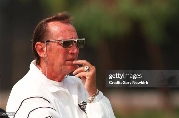 President and general manager Al Davis of the Los Angeles Raiders watches his team during a workout during training camp in El Segundo, California....