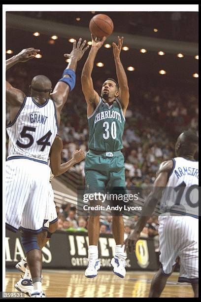 Guard Dell Curry of the Charlotte Hornets shoots the ball during a game against the Orlando Magic at the Orlando Arena in Orlando, Florida. The Magic...